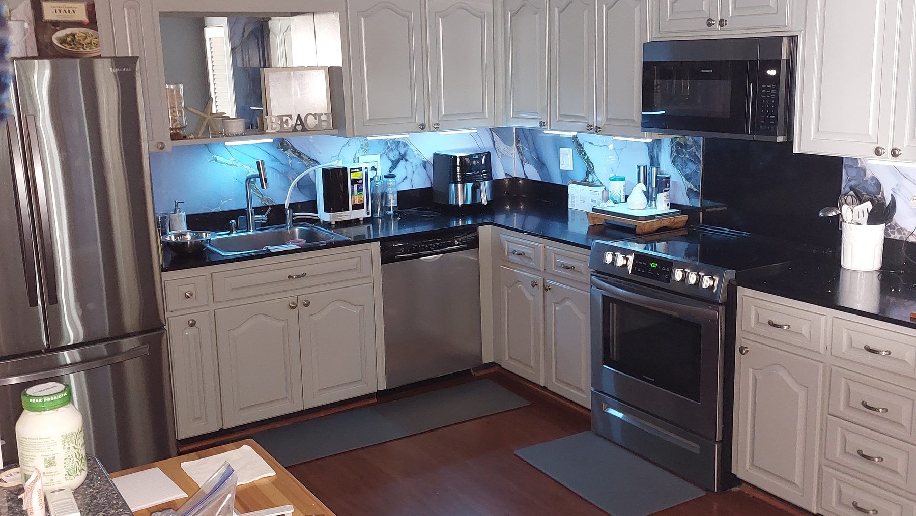 Kitchen with color changing under cabinet lighting