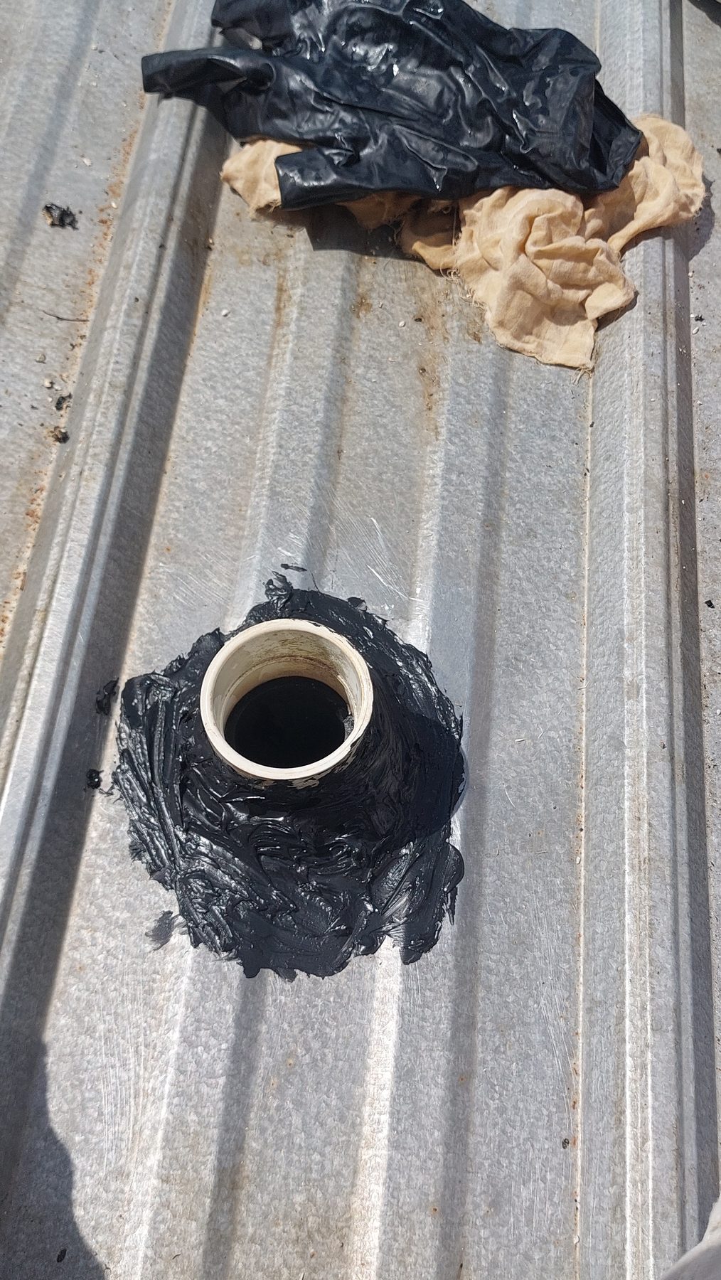 Pipe boot on metal roof after leak was sealed
