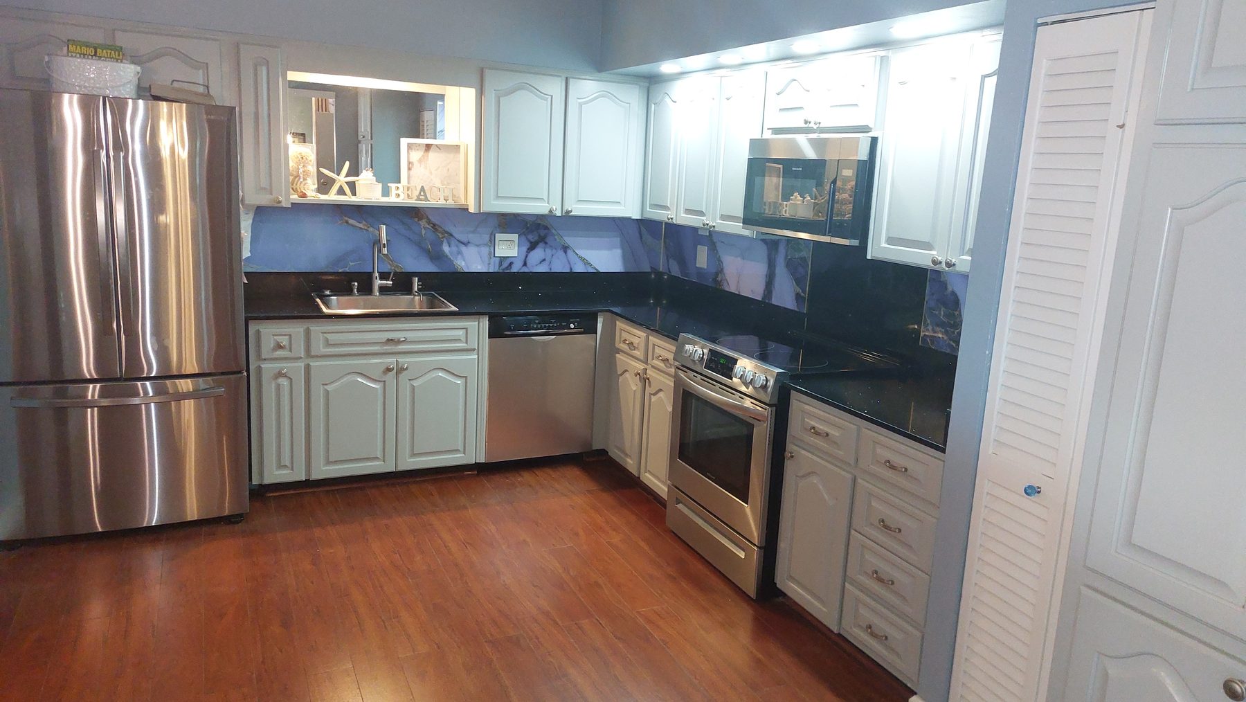 Kitchen with new marble style backsplash